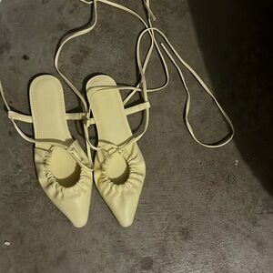 Yellow pointy tie flats